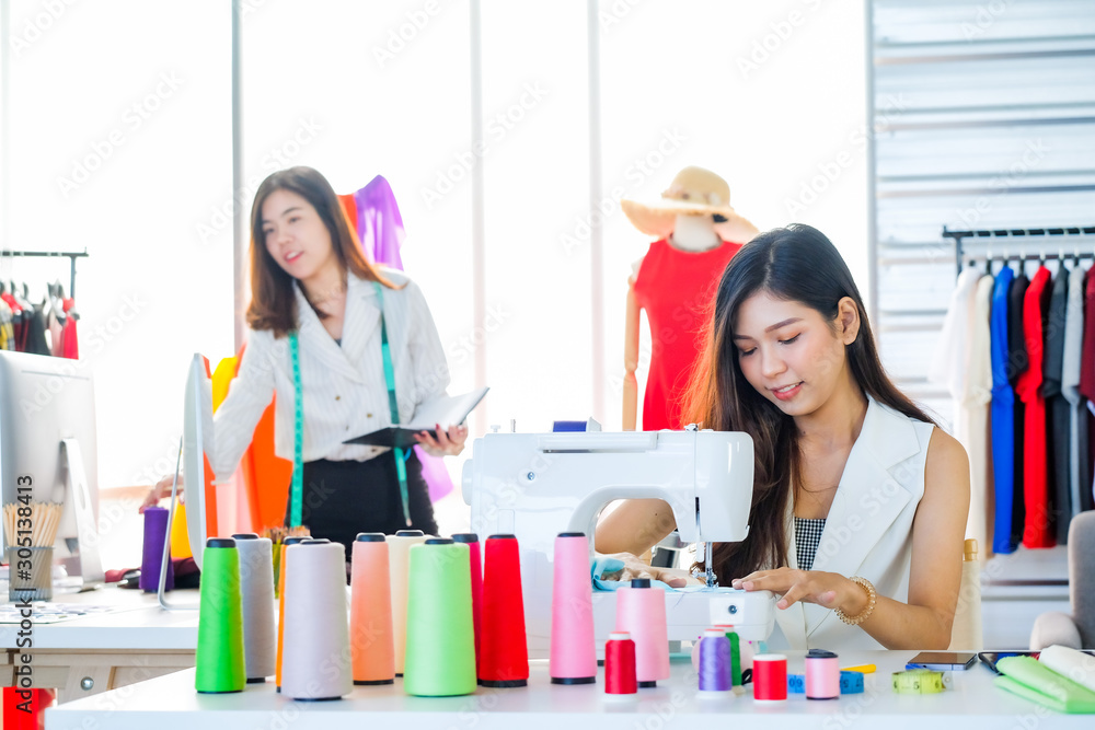 Asian women at work are fashion designers and tailors Asian women at work are fashion designers and tailors