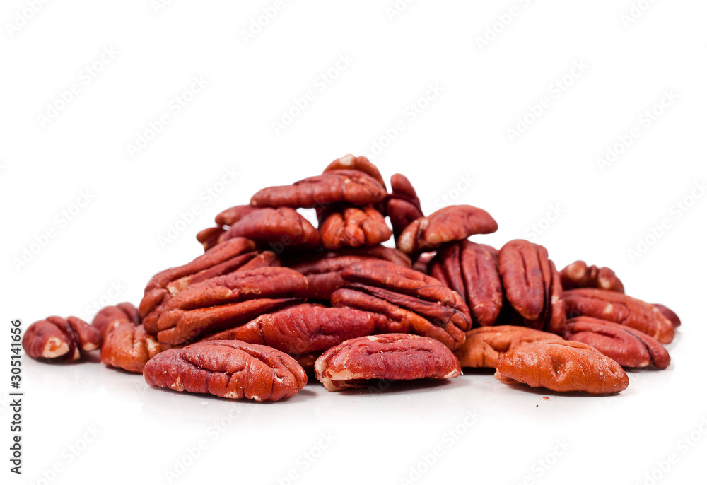 Peeled pecan nuts isolated on a white background.
