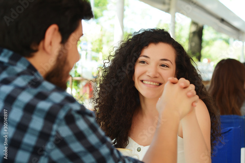 Wallpaper Mural Young attractive couple on date in coffee shop Torontodigital.ca