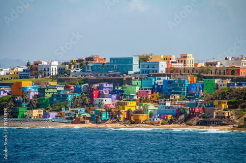Colorful houses line the hill side overlooking the beach in San Juan, Puerto Rico.