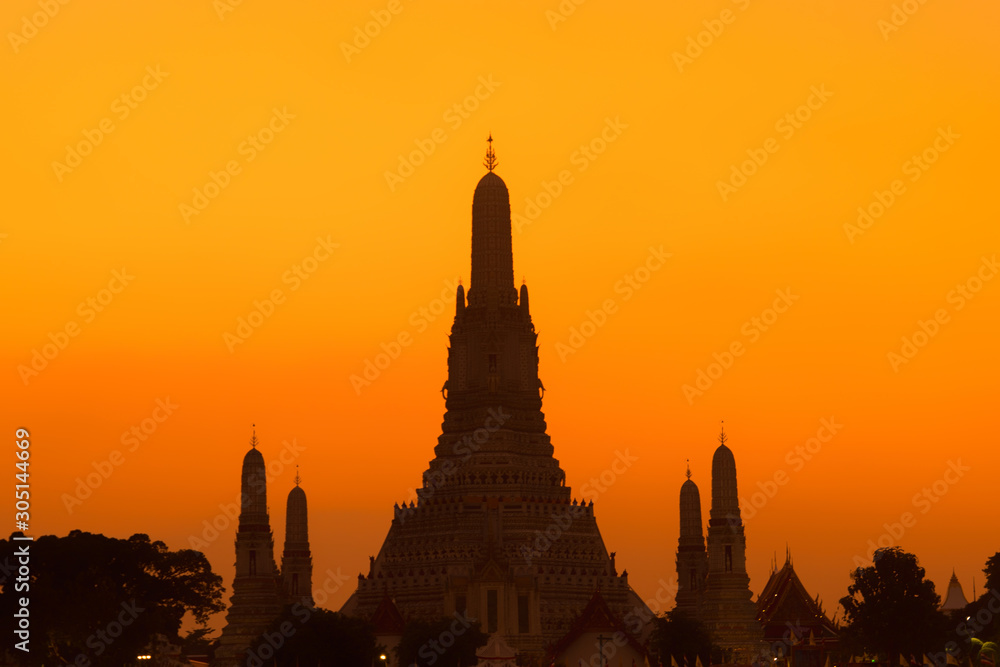 Wat arun temple.Buddhist temple in Bangkok Thailand,with Chao Phraya River.sunset time.