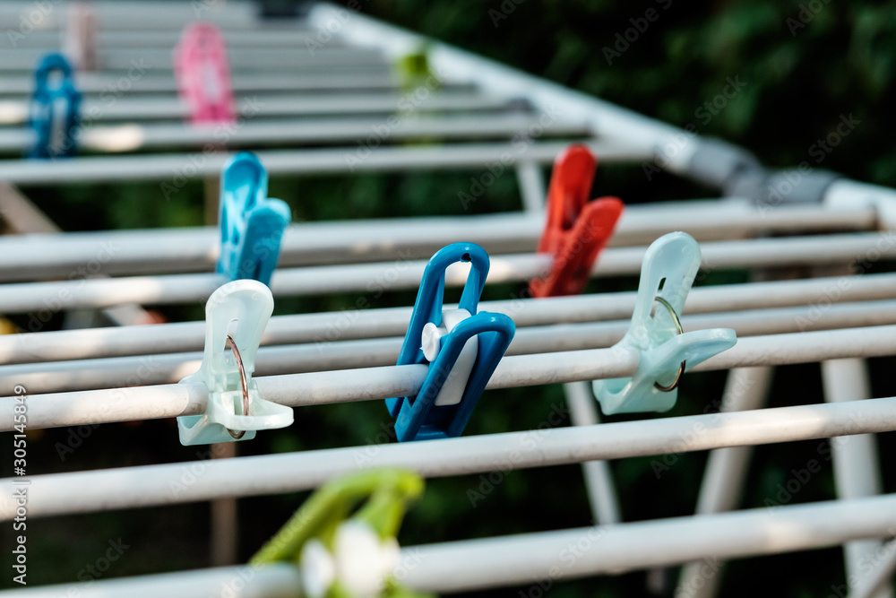 Cloth pegs in multicolor attached to the clothlines