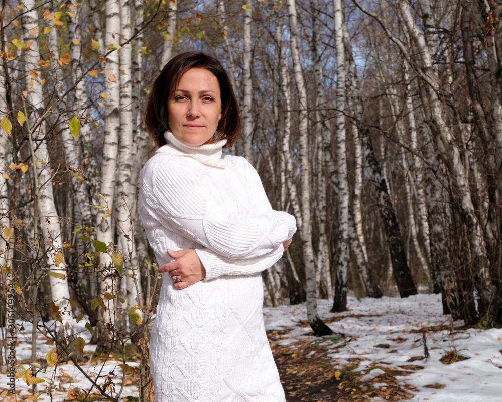Girl in a white dress. Autumn aspen forest. Girl in a white dress. Autumn aspen forest.