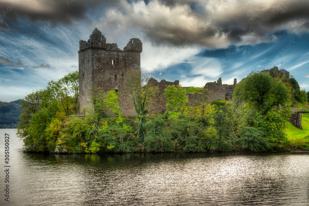 View of Urquhart Castle and Loch Ness in the Highlands of Scotland View of Urquhart Castle and Loch Ness in the Highlands of Scotland