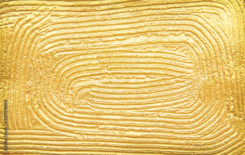 Gold paint on concrete wall surface in line seamless patterns for spiral yellow light background