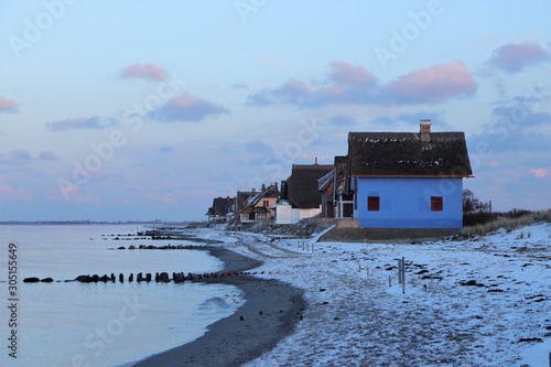 Fototapeta Naklejka Na Ścianę i Meble -  beachfront with colorful vacation homes in winter