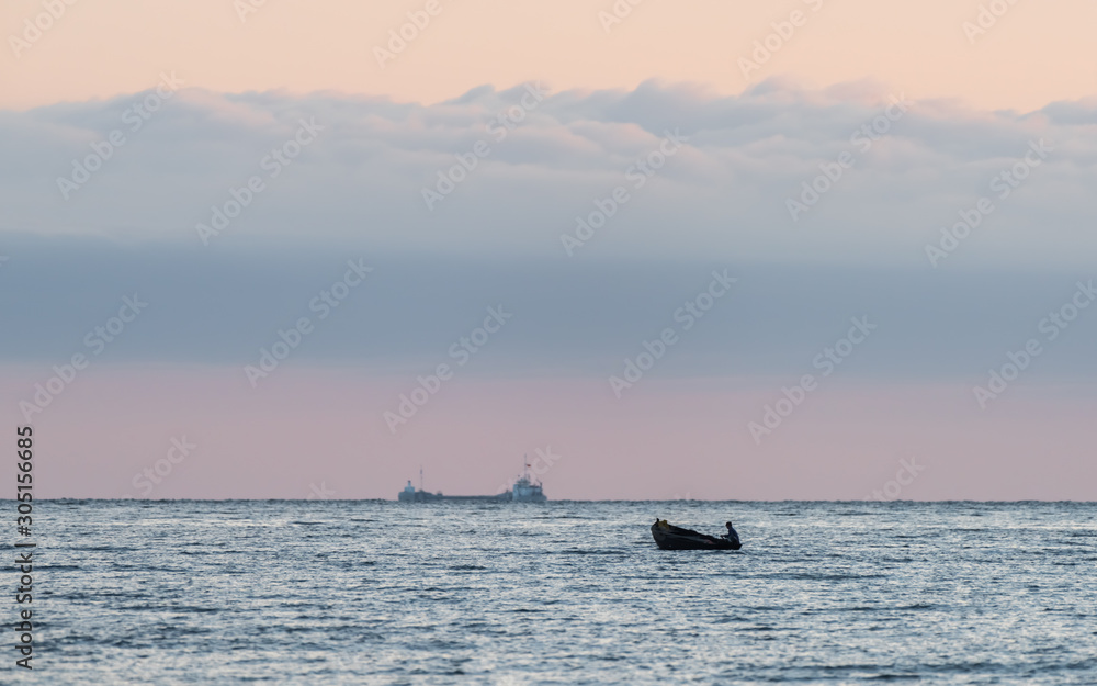A single boat goes out to the sea