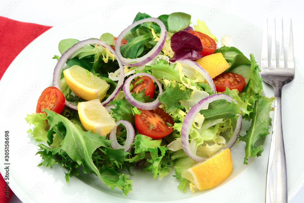 salad and raw vegetables on a plate