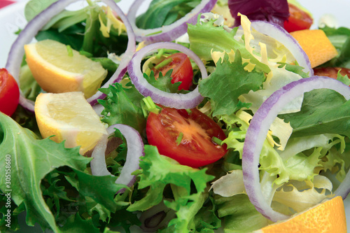 salad and raw vegetables on a plate