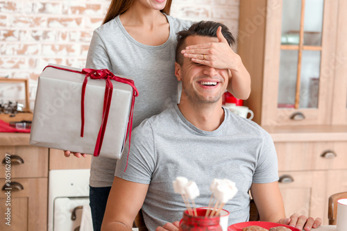 Happy young woman giving Ch...