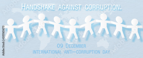 White human handshake together in paper cut style with wording of International anti-corruption day on 9 December., All on world map and isolate on light blue background in vector design.