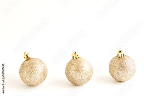Golden Christmas decorations. Christmas balls Isolated on a white background. The concept of luxury winter holidays. Banner for the web page.