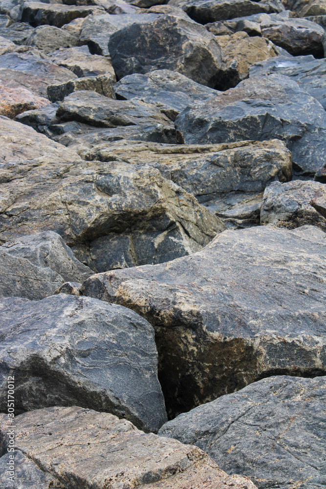 This is a picture of hard rocks near the seashore.