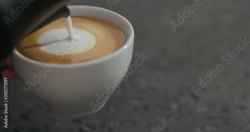 steamed milk pour into cappuccino