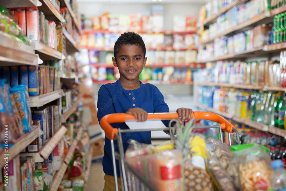 boy with  cart  in shop
