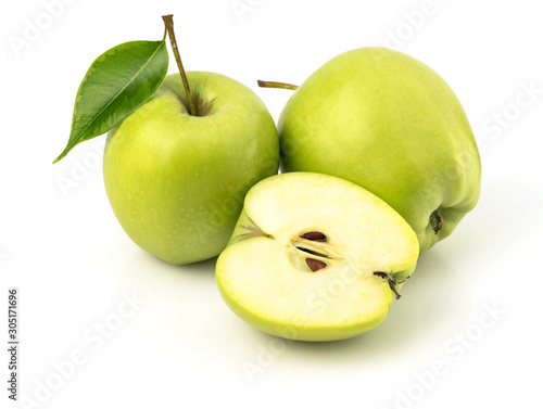 Green apples with leaves isolated on white background
