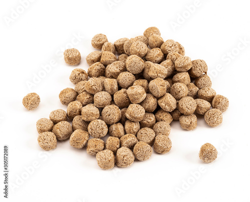 Heap of bran particles isolated on white