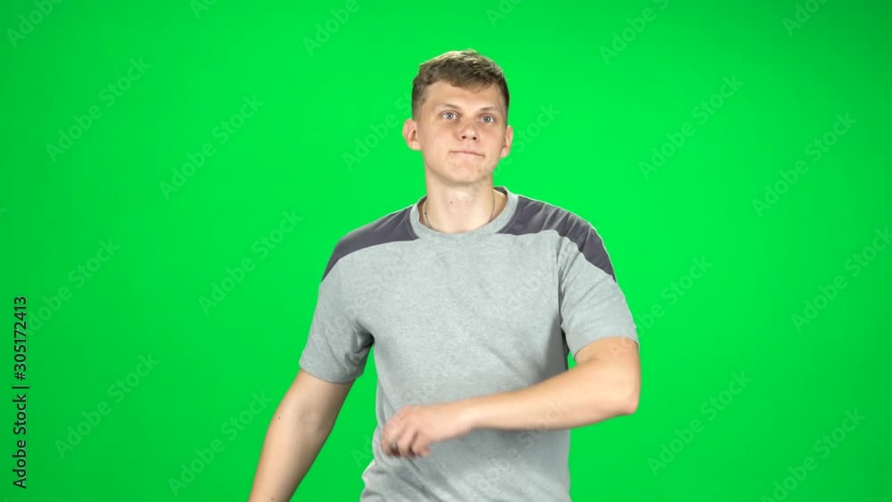 Guy goes and dances, smiles and rejoices on a green screen, Chroma Key Guy goes and dances, smiles and rejoices on a green screen, Chroma Key