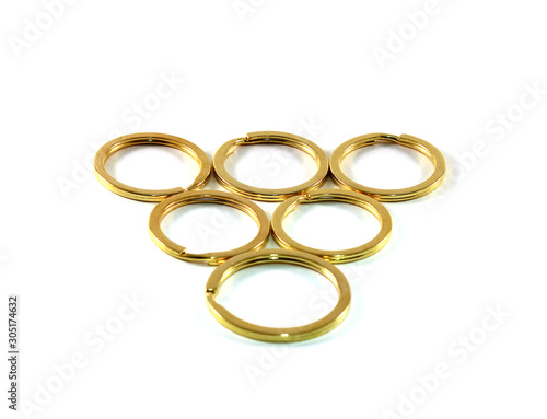 Gold round rings laid out in the form of a pyramid.