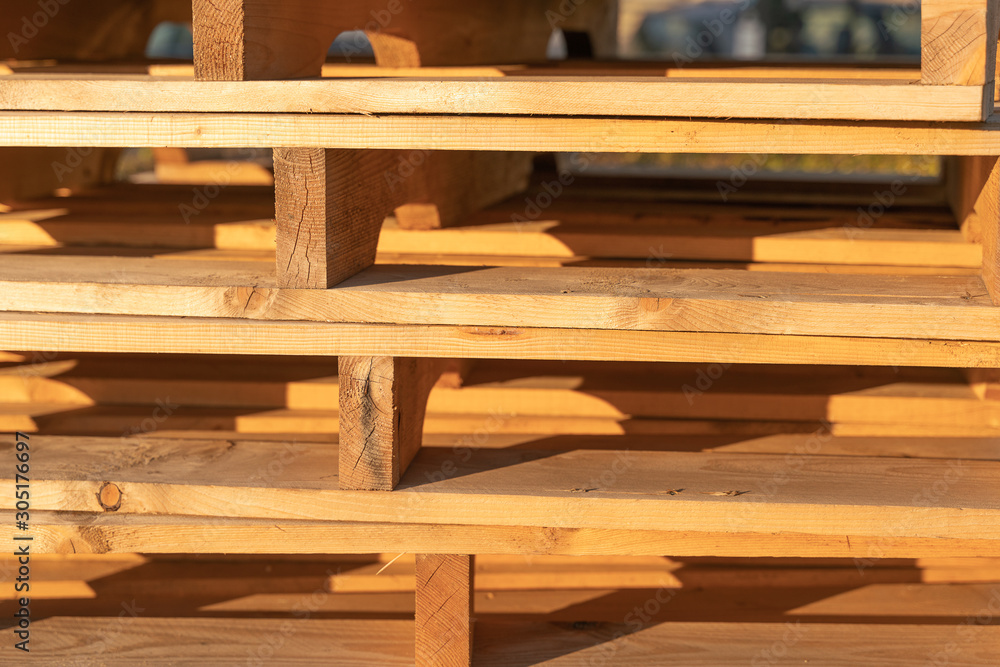 wooden pallets are folded for storage wooden pallets are folded for storage