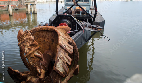 The boat absorbs sand that is rusting.