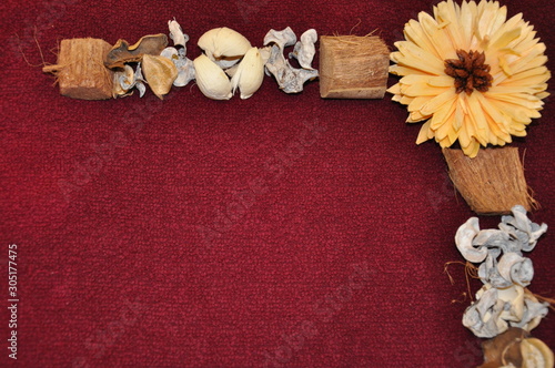 Fall decoration dried trinkets and diy frame on bordoux surface