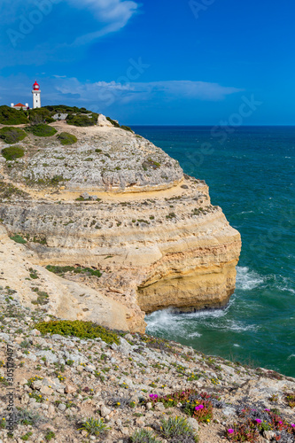 Farol de Alfanzina, a lighthouse near Carvoeiro at the southern coast of the Algarve, Portugal. photo