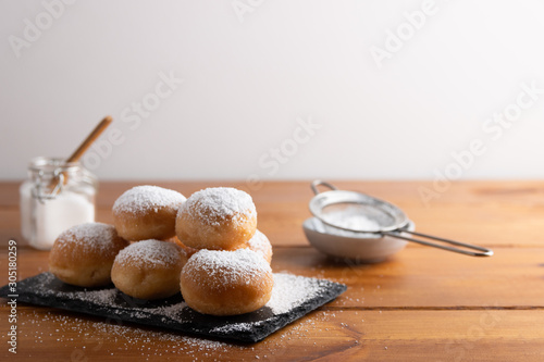 Quadro su tela Carnival italian deep fried fritters with sugar icing,Homemade deep fried sweet