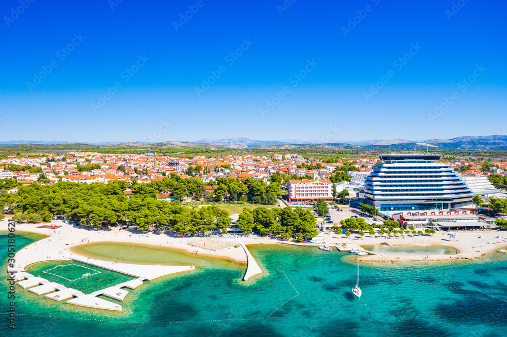 Touristic resorts in town of Vodice, amazing turquoise coastline on Adriatic coast, aerial view, Croatia