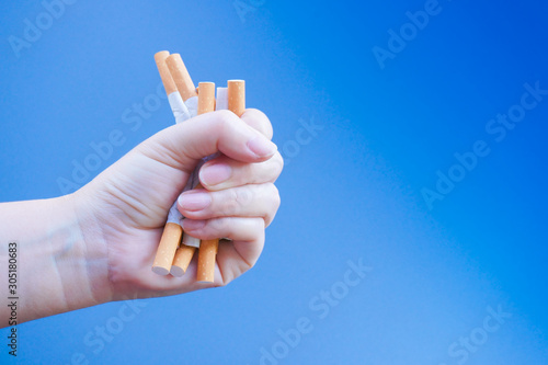 Broken cigarette on hand. Winning with addicted nicotine problems,No smoking. Quitting from addiction concept.