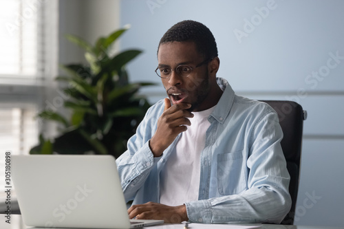 Stunned african American man shocked by online news