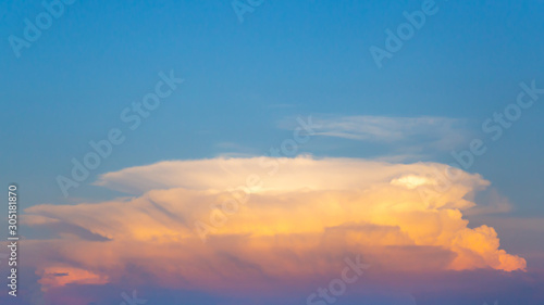 Big strange clouds on the blue sky at evening or sunset time. © Phongsak