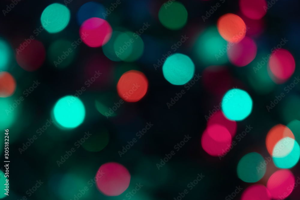Festive christmas blurred lights teal green and pink bokeh background