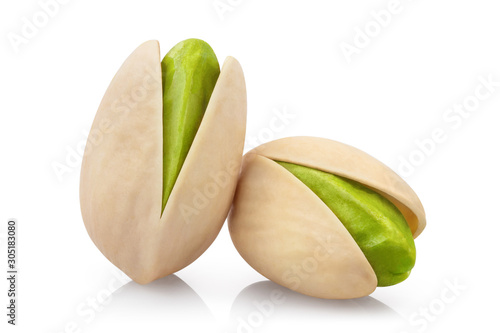 Close-up of tasty pistachios, isolated on white background