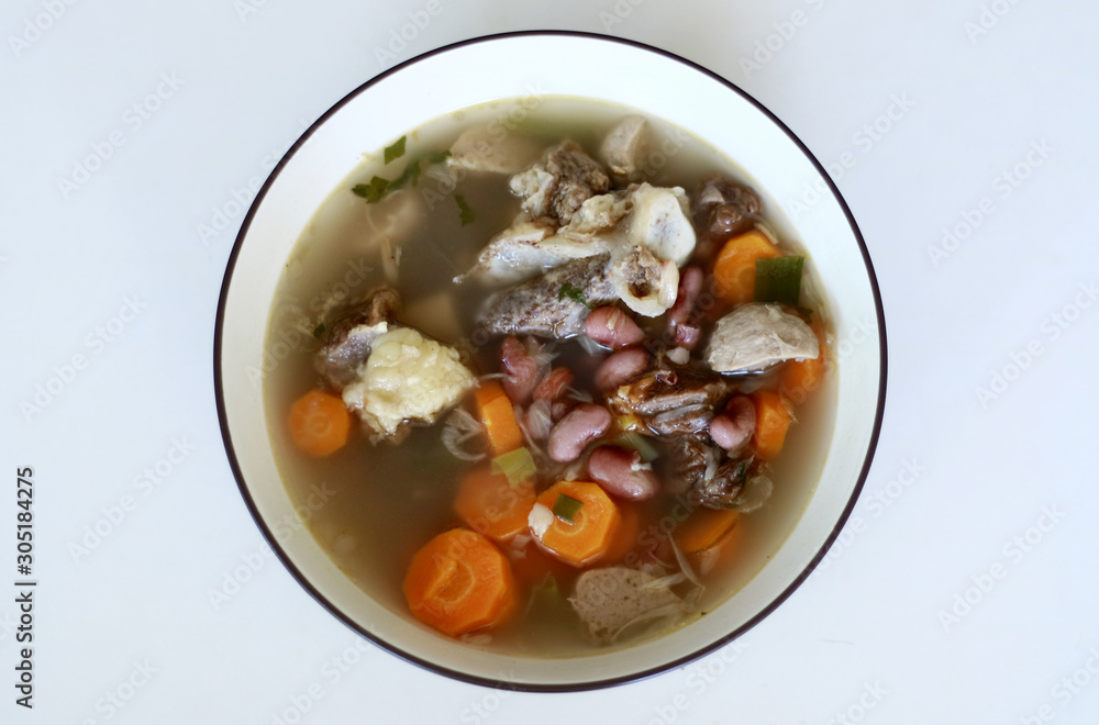Red kidney bean soup on white background. Indonesian food. Red kidney bean soup on white background. Indonesian food.