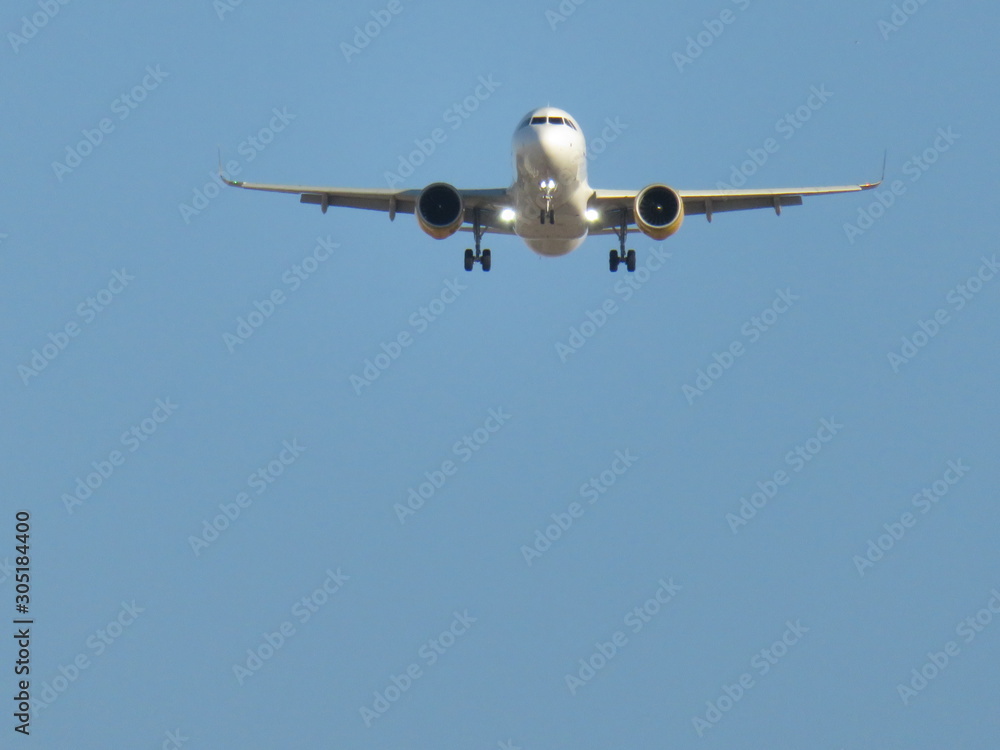 Beautiful photo of a plane landing at the airport taking land Beautiful photo of a plane landing at the airport taking land