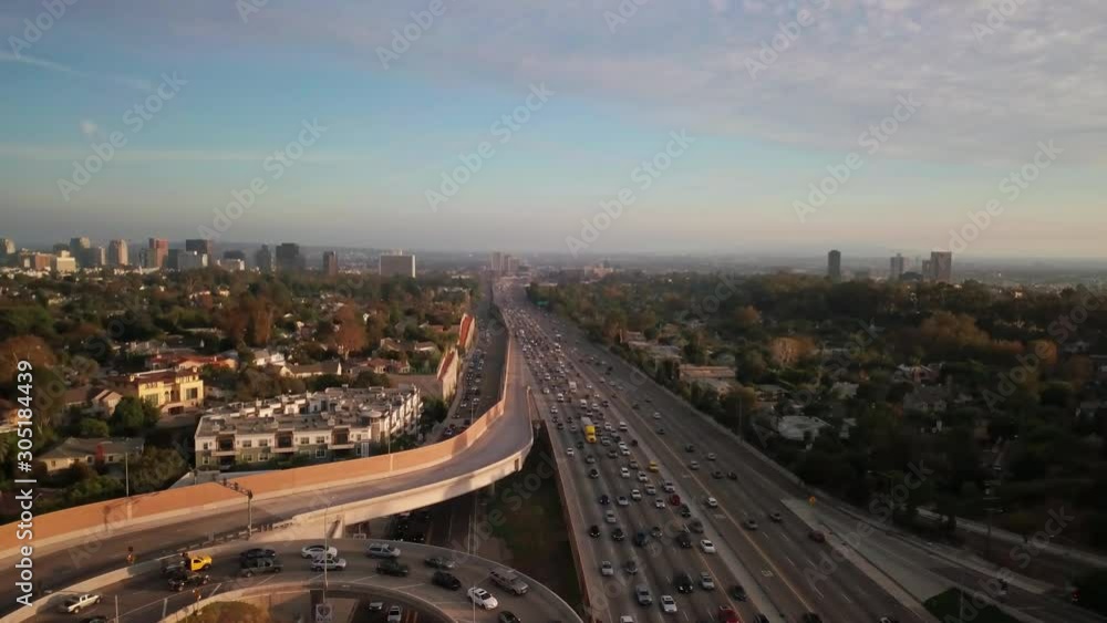Wide aerial shot of traffic flow during rush hour looking southbound on the freeway in West Los Angeles. 4K Wide aerial shot of traffic flow during rush hour looking southbound on the freeway in West Los Angeles. 4K