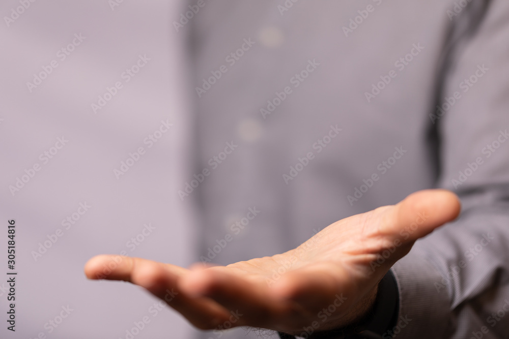 Obraz premium Businessman without head holding something without theme