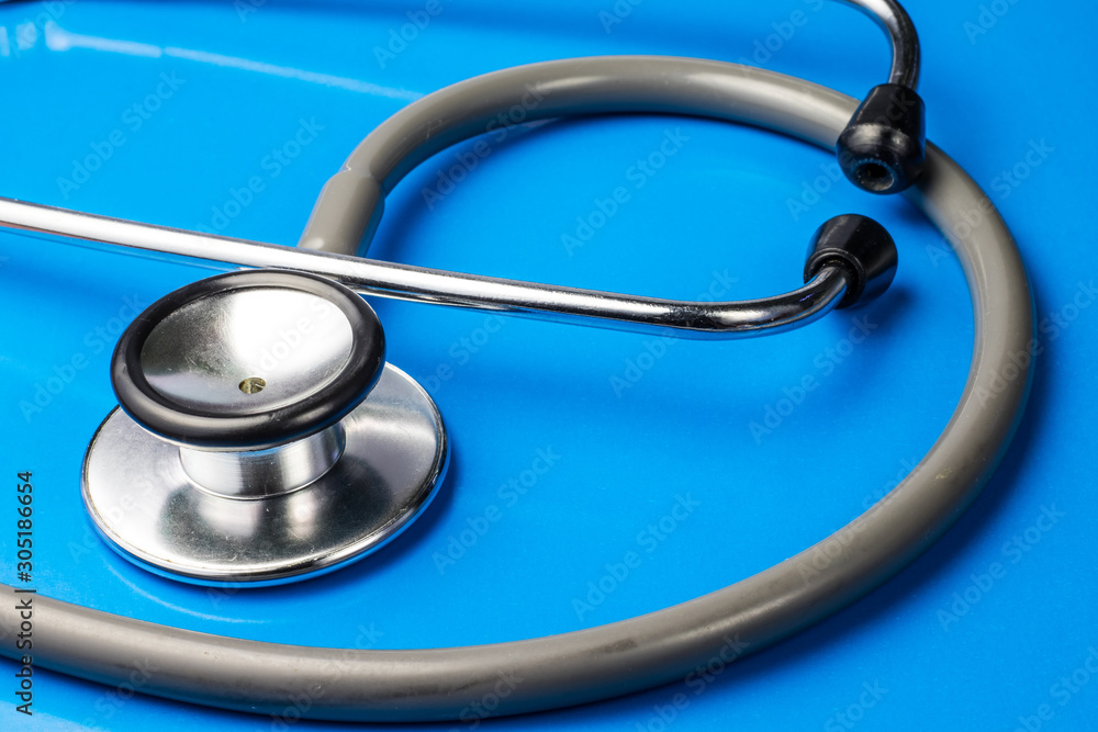 stethoscope on blue surface