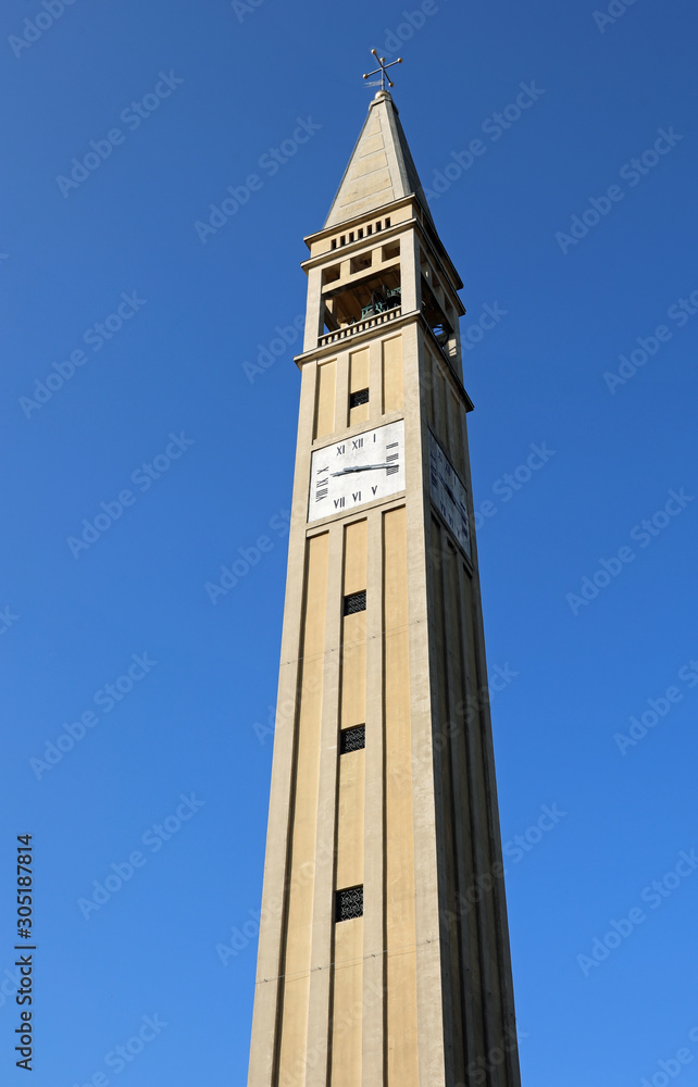 Very tall Bell Tower with Pyramidal spire with a square base and