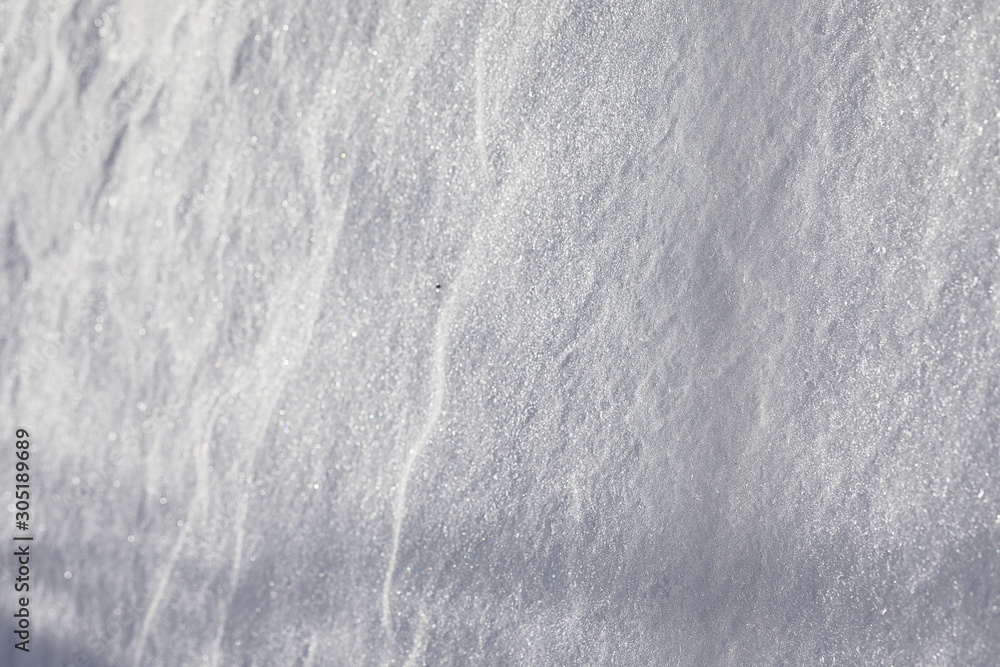Obraz premium The texture of the snow. Winter rainfall. Tracks on a snowy road after a snowfall.