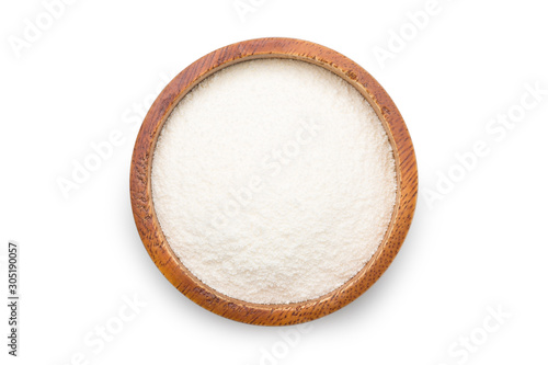 On top of powder creamer in a wooden cup. Clipping path.