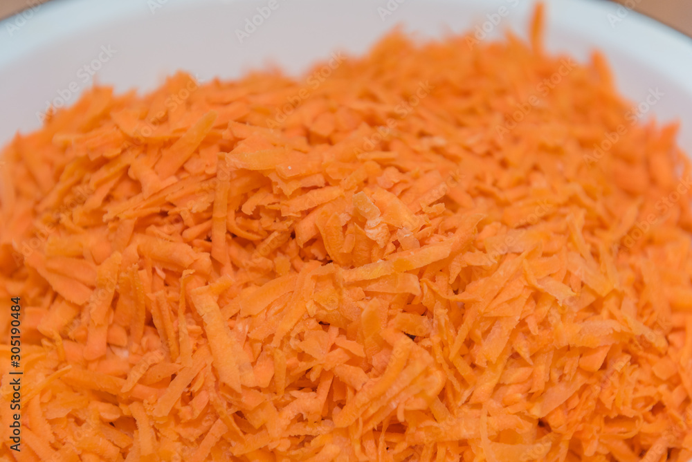 background grated carrots. carrots close-up. finely grated carrots. texture of carrots. background grated carrots. carrots close-up. finely grated carrots. texture of carrots.