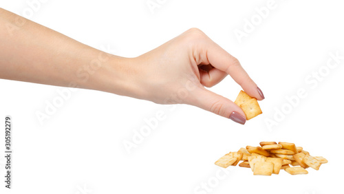 Square mini salted crackers, snack food. Isolated on white.