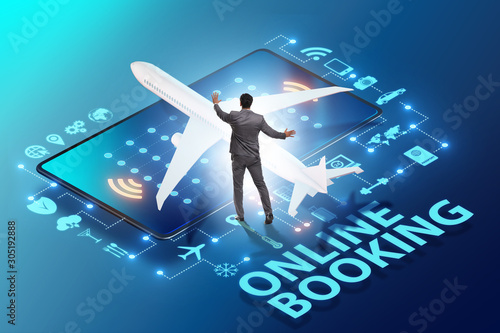 Concept of online airtravel booking with businessman photo