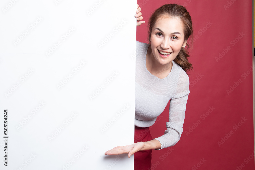 Young Asian woman present blank sign with palm hand. Young Asian woman present blank sign with palm hand.