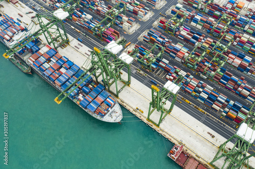Photography View from above, stunning aerial view of the port of Singapore with hundreds of colored containers ready to be loading on the cargo ships