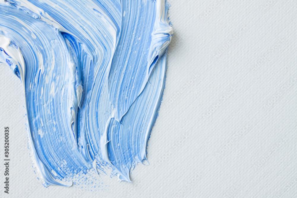 Mixing blue and white paint on canvas