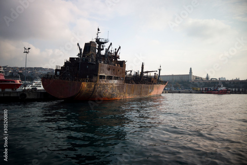 Burned ship on the port