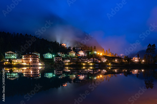 Nightshot of the Masare village at Lago di Alleghe lake in South Tyrol © Ina